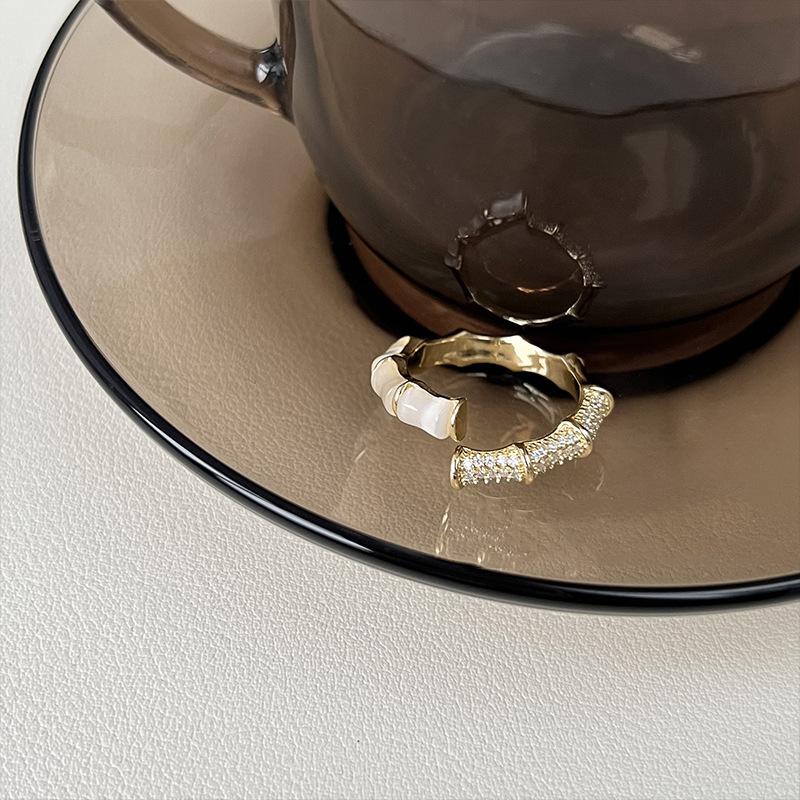 

Adjustable Sophisticated Womens Ring With Bamboo Element And Cat Eye Stone Charm