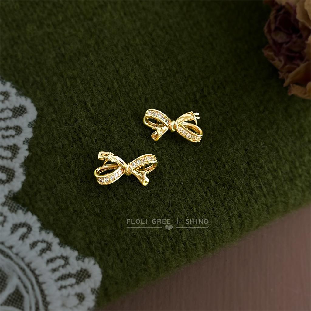 

Mangxing micro-inlaid zircon bow s needle creative light luxury earrings