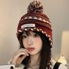 Cozy Chic Knitted Winter Hat For Women Featuring Colorful Pom Poms And Warmth