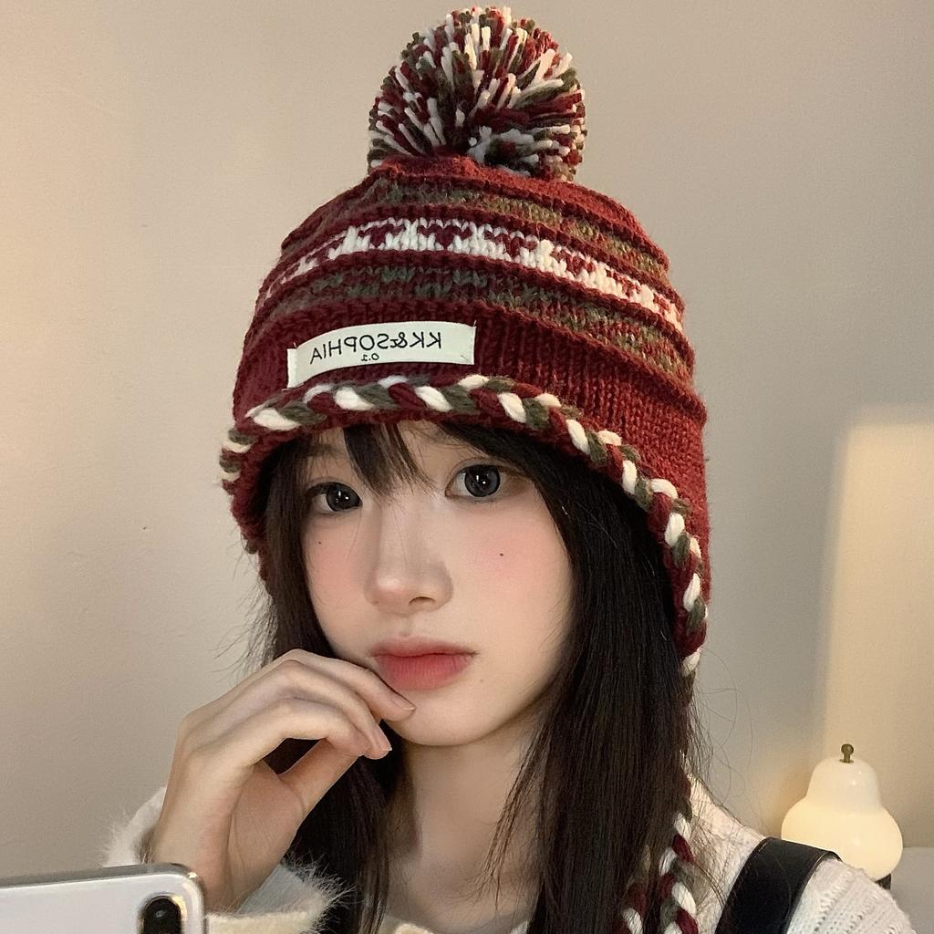 Cozy Chic Knitted Winter Hat For Women Featuring Colorful Pom Poms And Warmth