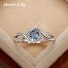 Huitan Elegant Women Ring Twist Design Inlaid Sparkling Blue CZ Fashion Party Engagement Noble Lady Accessories Delicate Jewelry