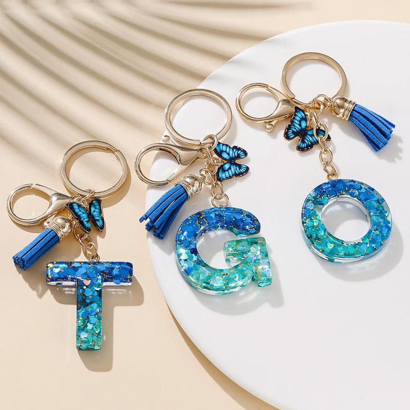 1 Stück Schriftzug Schlüsselanhänger für Rucksackanhänger Schlüsselanhänger Schlüsselring mit Quaste Schmetterling Niedlich Farbverlauf Harz Blau Pailletten