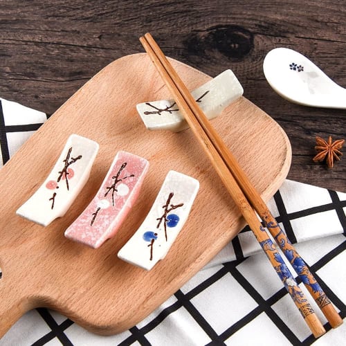 Cute and Stylish 4-piece Chopstick Rest Set Featuring a Plum Blossom Design. Includes Chopstick Rests, a Chopstick Holder, and a Cutlery Rest. This Ja