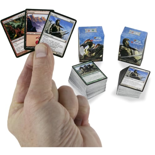 The world's smallest Magic: The Gathering exclusive collector's set, featuring Ajani vs. Nicol Bolas and Heroes vs. Monsters dueling decks and exclusi