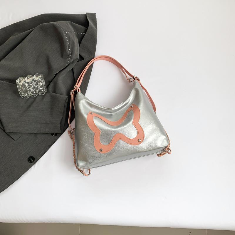 

Simple and stylish large-capacity backpack women s 2024 summer new trend student tote bag shoulder armpit bag срібний