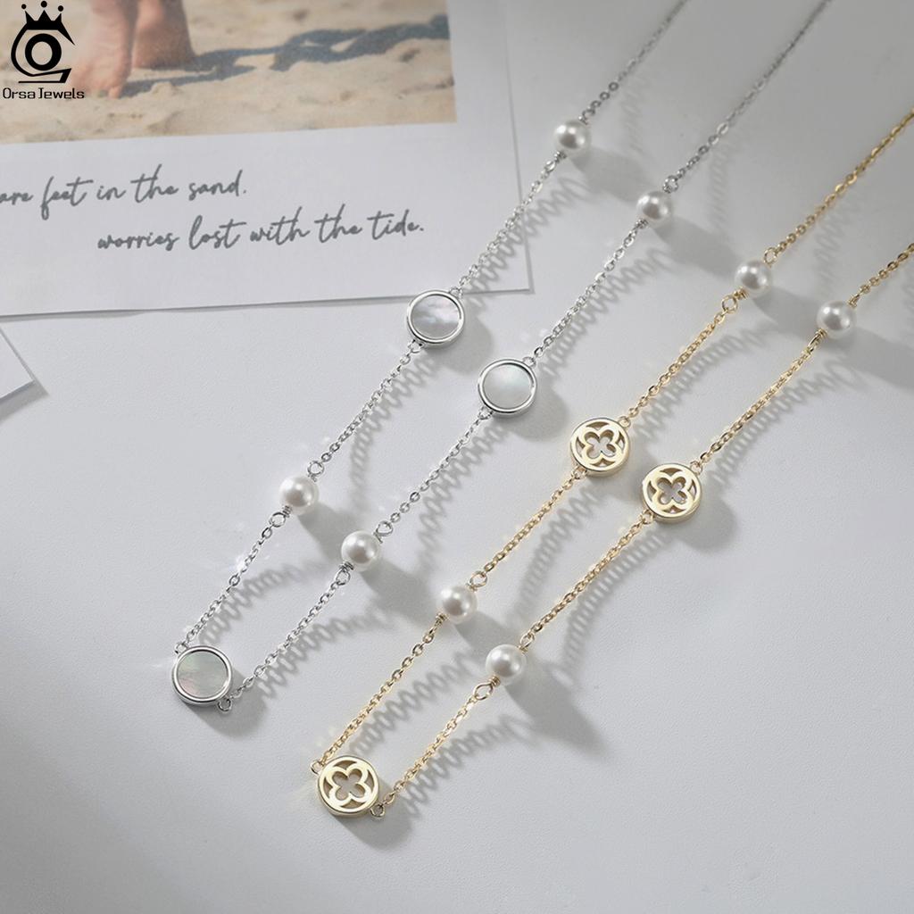 ORSA JEWELS Glänzende Muschelperlen-Choker-Halskette 925er Sterlingsilber Kleeblatt-Design Natur-Stil Sommergeschenk GMN63