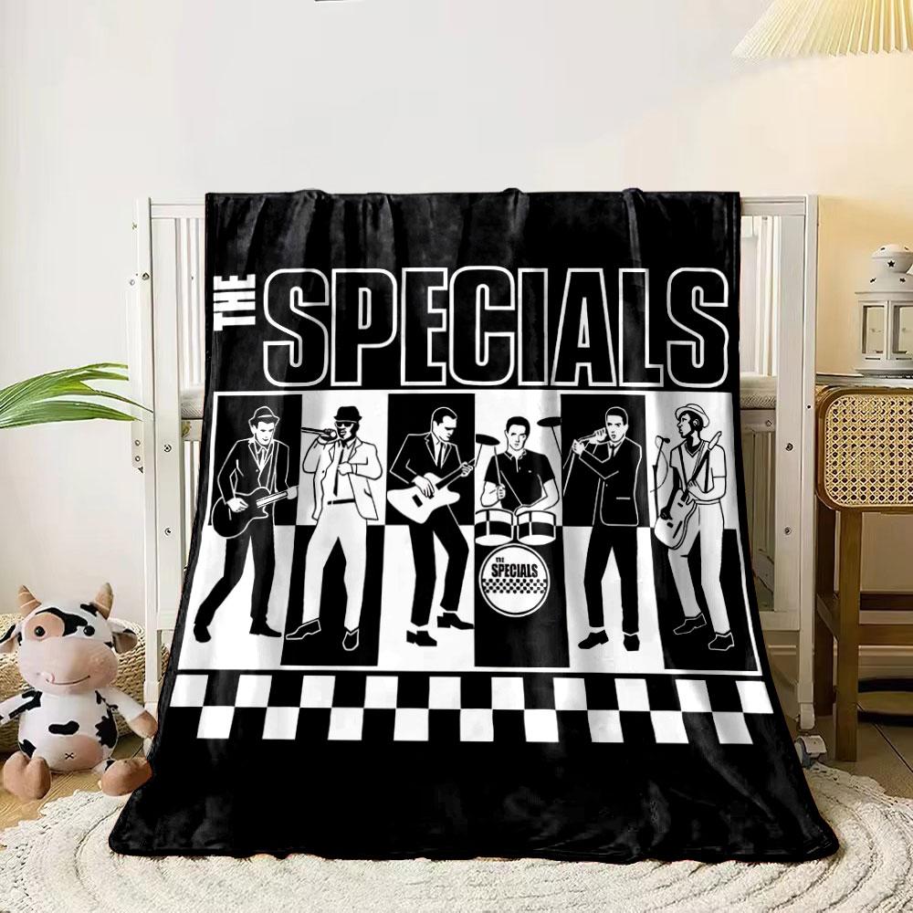 Black-and-white checkerboard design with illustrated band members. for all seasons blanket lunch break throw gift 80cm x 120cm