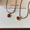 Autumn and winter tiger's eye stone leather rope pull necklace female Merad Yadan style long sweater chain simple and fashionable collarbone chain