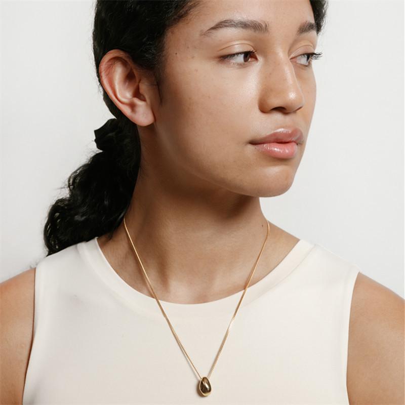 Gold-Plated Brass Pendant Necklace with Irregular Faceted Design - Retro, Versatile, and Stylish.
