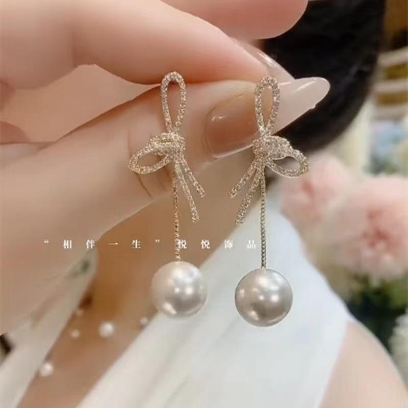 

2024 Trendy Pearl Bow Drop Earrings - Elegant French Design for Influencers