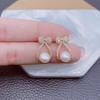 Simple and compact bow pearl earrings, women's atmosphere stud earrings, niche temperament, versatile and popular ear jewelry