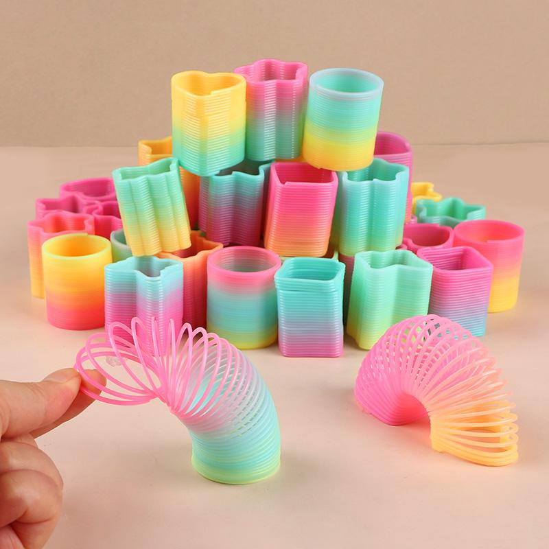 12/24 Stück Regenbogen Magische Feder Hüpfspielzeug Kindergeburtstag Mitgebsel Goodie Piñata Füller Fidget Spielzeug Kreative Weihnachtsgeschenke
