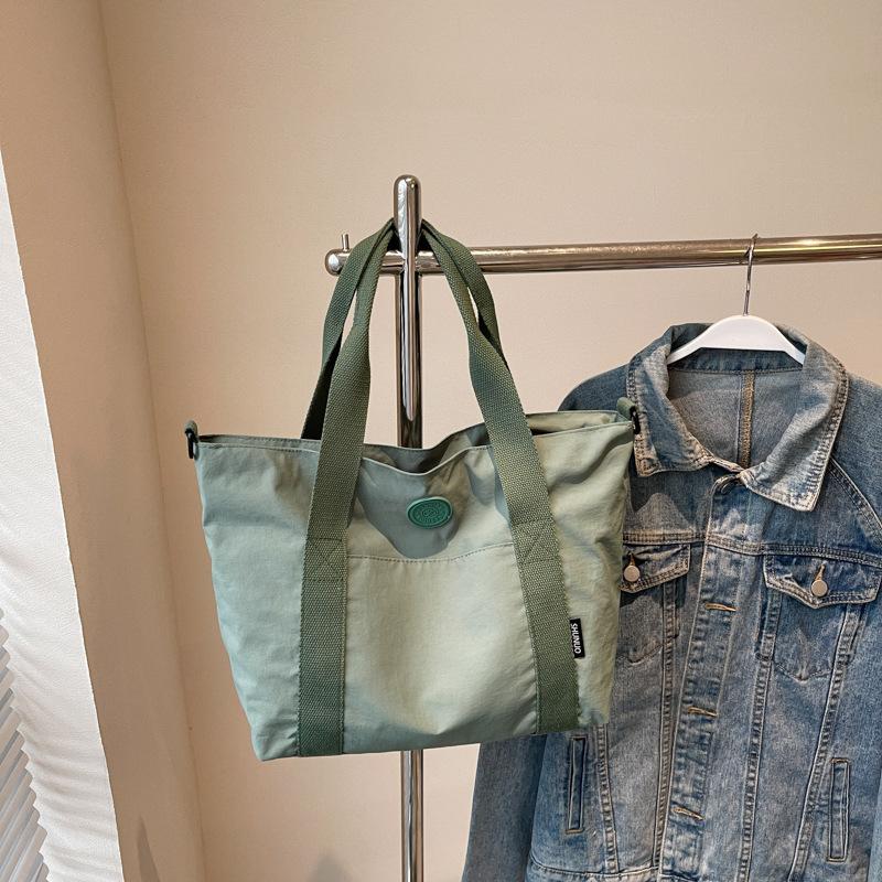 Large-capacity niche design tote bag 2025 new Korean version trendy handbag personalized solid color shoulder bag trendy