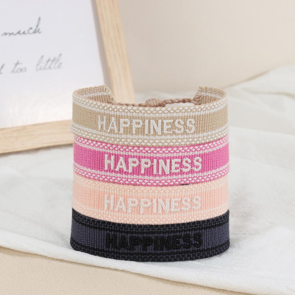 Europäisches & Amerikanisches Besticktes Freundschaftsarmband: Handgefertigter gewebter Quaste mit Logo-Schriftzug.