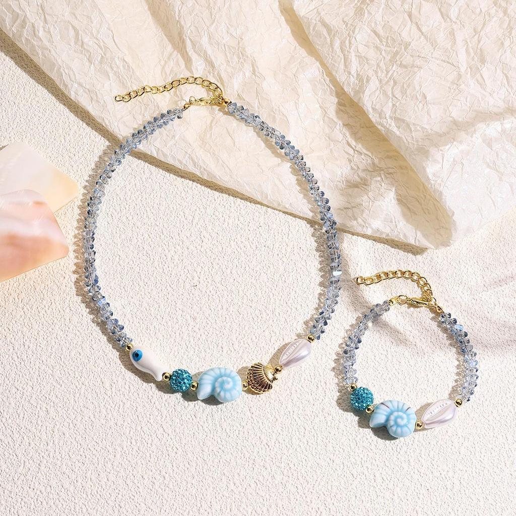 Seaside Elegance: Starfish & Shell Bead Bracelet with Oceanic Flair