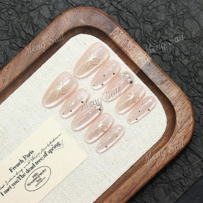 Magic Mirror Bow: Handmade Pink Cat Eye Nail Art with Sweet Heart Design