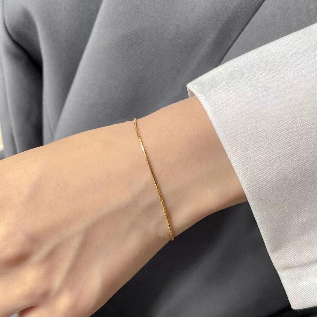 Women's Gold Snake Bone Chain Bracelet/Anklet - 2023 High-End Titanium Steel, Non-Fading, Niche Design.