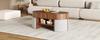 Oval storage coffee table with vertical fluted panelling, set with fabric stools, body made of particleboard+MDF, metal handles, with sliding doors