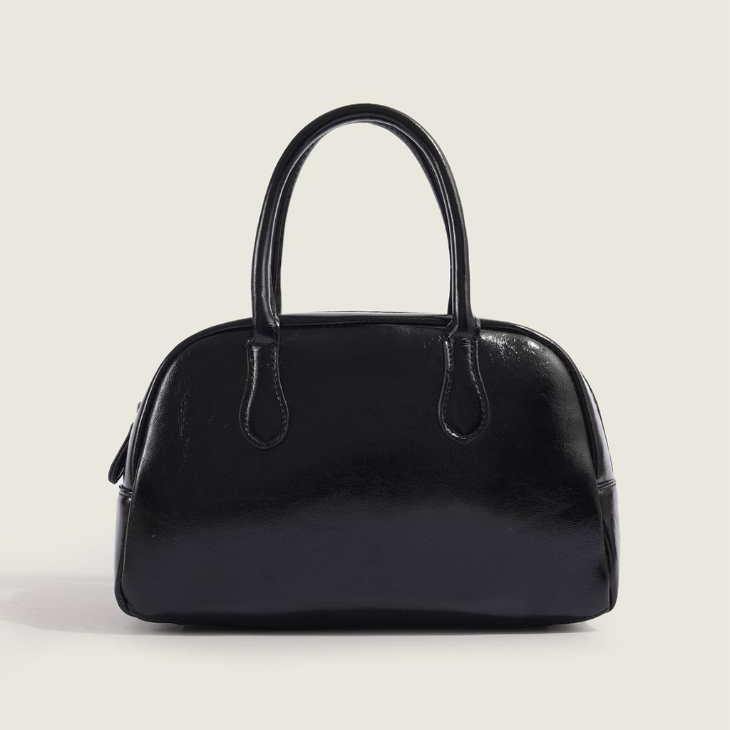 2025 Neue Koreanische Dongdaemun Nischen Handgehaltene Kissen Tasche für Damen Einfache Textur Pendler Handgehaltene Boston Tasche