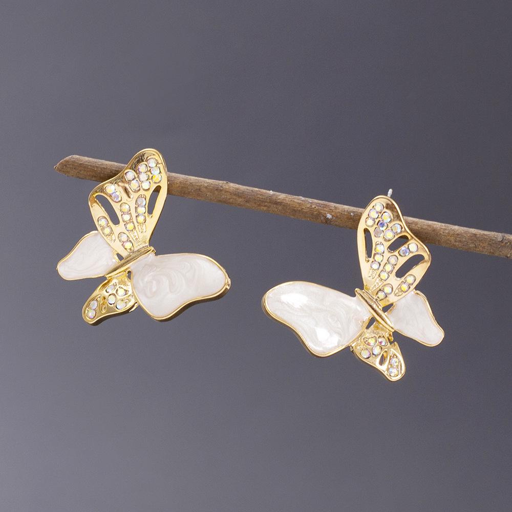

Винтажные корейские серьги-пусеты в виде бабочек с инкрустацией бриллиантами золотой