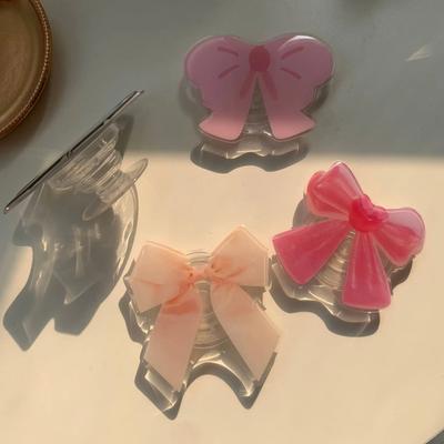 Support de sac gonflable en forme de nœud papillon pour filles mignonnes pour téléphones portables iPhone Android, support de bureau pour regarder, étui de téléphone, décoration