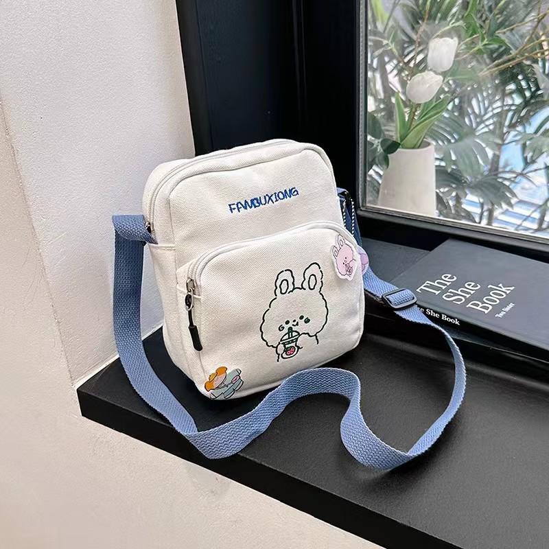 

Cute cartoon canvas mobile phone bag 2025 new printed trendy portable sweet shoulder messenger bag pocket money