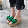 Slippers women's summer non-slip 2025 new ultra-fashionable thick-soled outer wear beach outdoor one-word flower Korean version of high heels