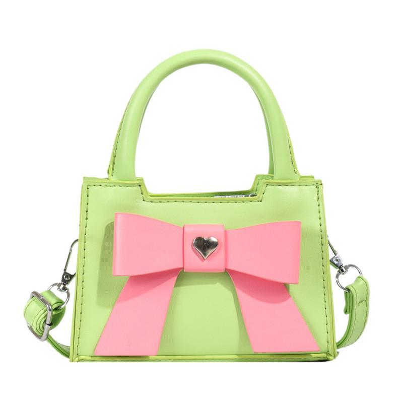Stylish Korean Toddler Shoulder Bag For Kids Featuring Chic Color Block Design And Sweet Bow Detail