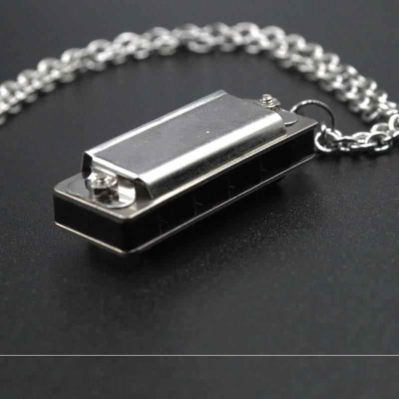 Ye Yin has the same style, which can be blown, harmonica necklace, earth cool dancing, literary couple pendant chain, sweater chain, accessories tide.