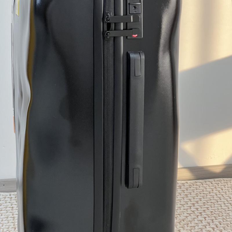Embossed Italian 20" Carry-on Suitcase with Universal Wheels and Customizable Lock.