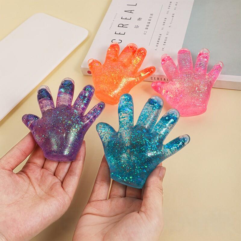 Giocattolo Spremibile Morbido a Forma di Mano in TPR con Paillettes Rimbalzo Lento Squishy Giocattolo per il Palmo Gadget per Alleviare lo Stress per Adulti e Bambini
