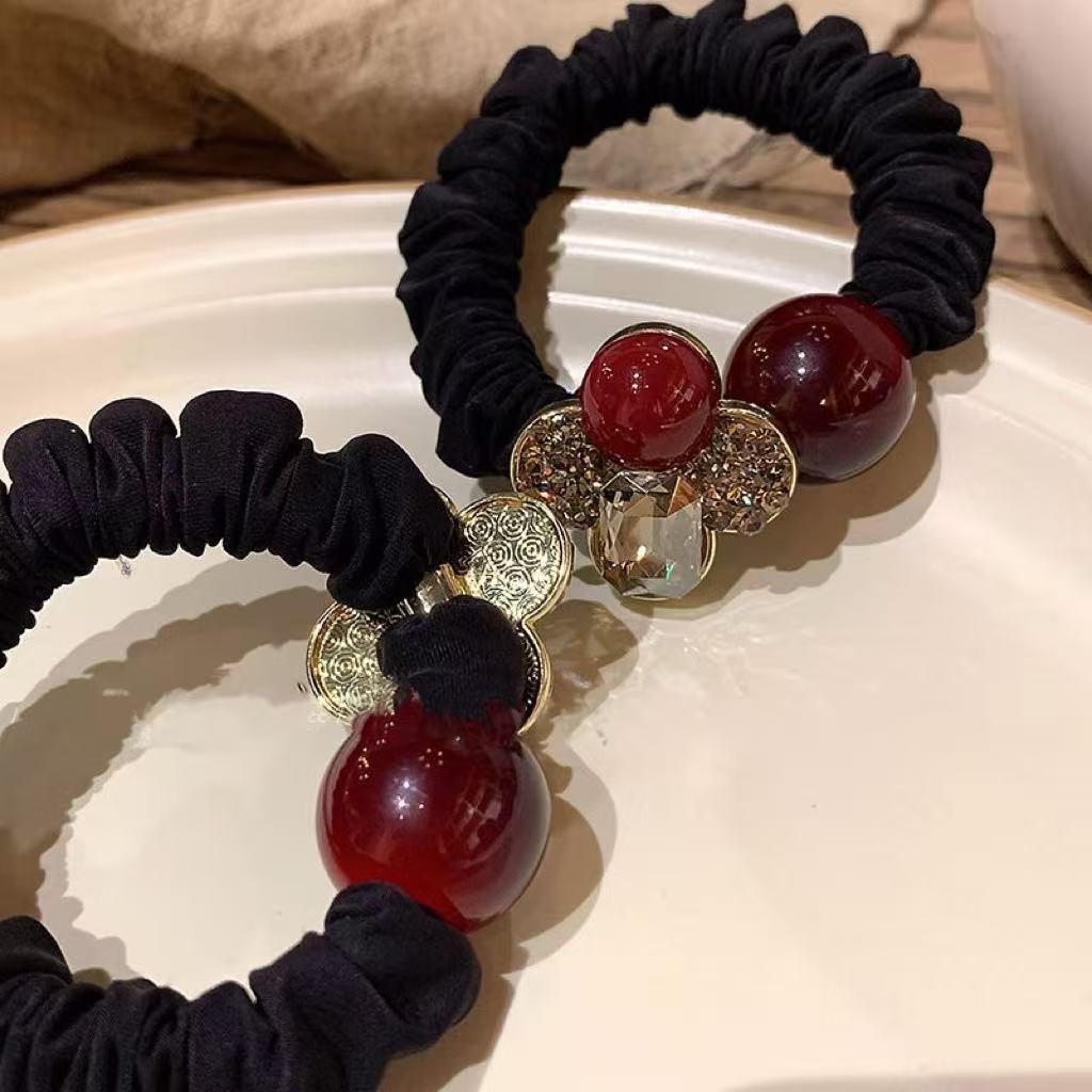 Haargummi mit Strass-Vierblattblume – Elegantes und strapazierfähiges Haarband für Damen