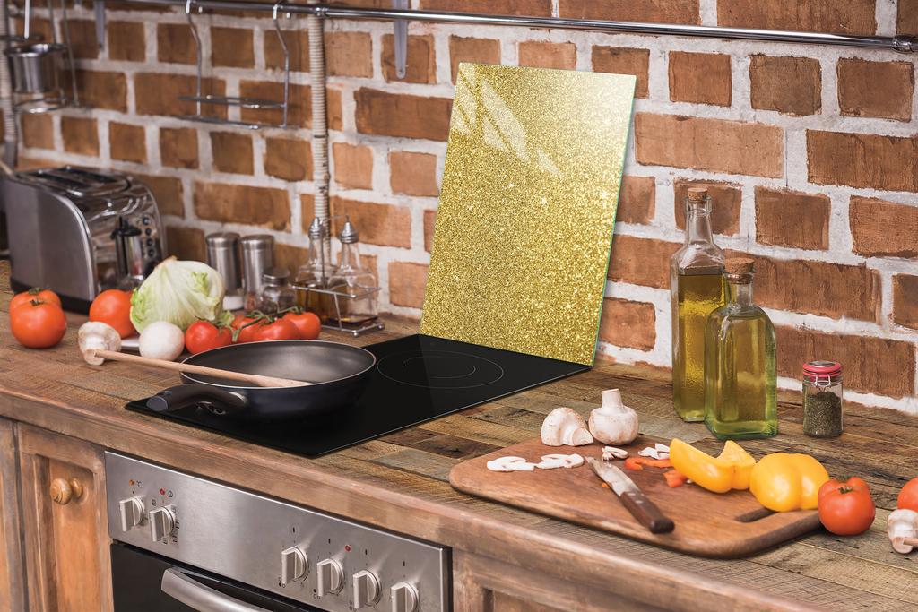 TAGLIERE IN VETRO 35x52 DORATO