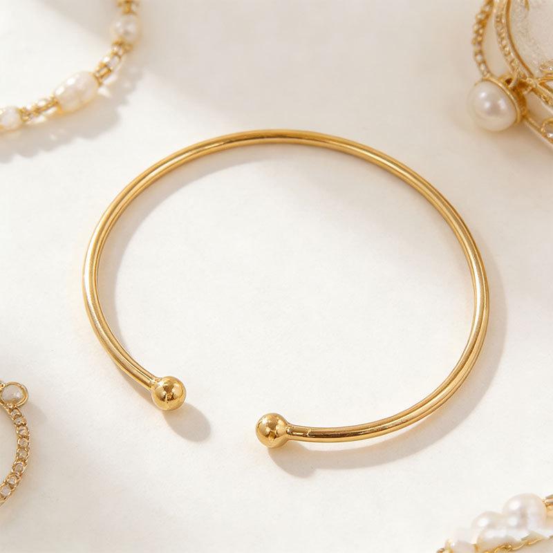 Adjustable Metal Arm Bracelet with Dual Balls & Water Drop Design: Exaggerated Style for Women