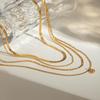 European & American Influencer Fashion Necklace: 18K Gold Stainless Steel Four-Layer Chain with Diamond Pendant.