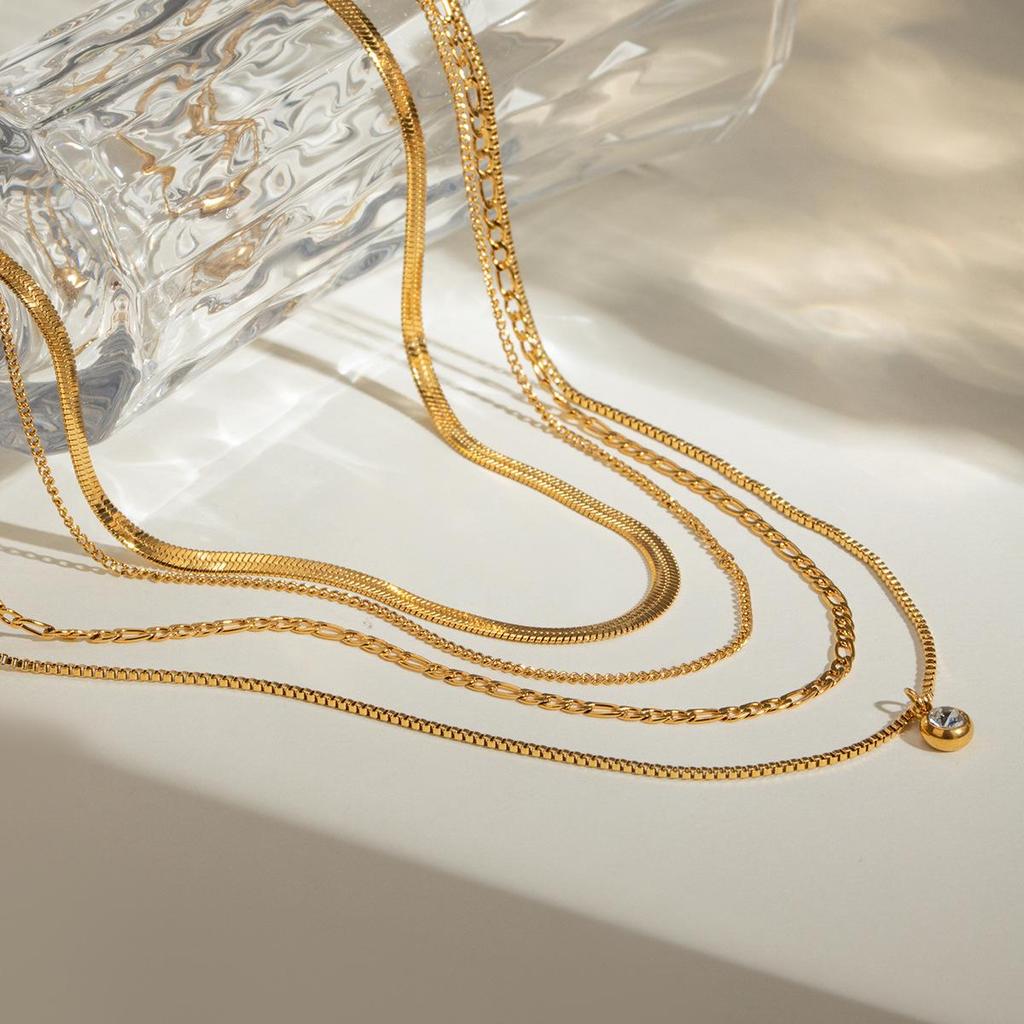 European & American Influencer Fashion Necklace: 18K Gold Stainless Steel Four-Layer Chain with Diamond Pendant.