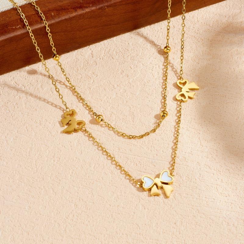 Gold Bow Charm Jewelry Set: Necklace and Bracelet with White Enamel Accents