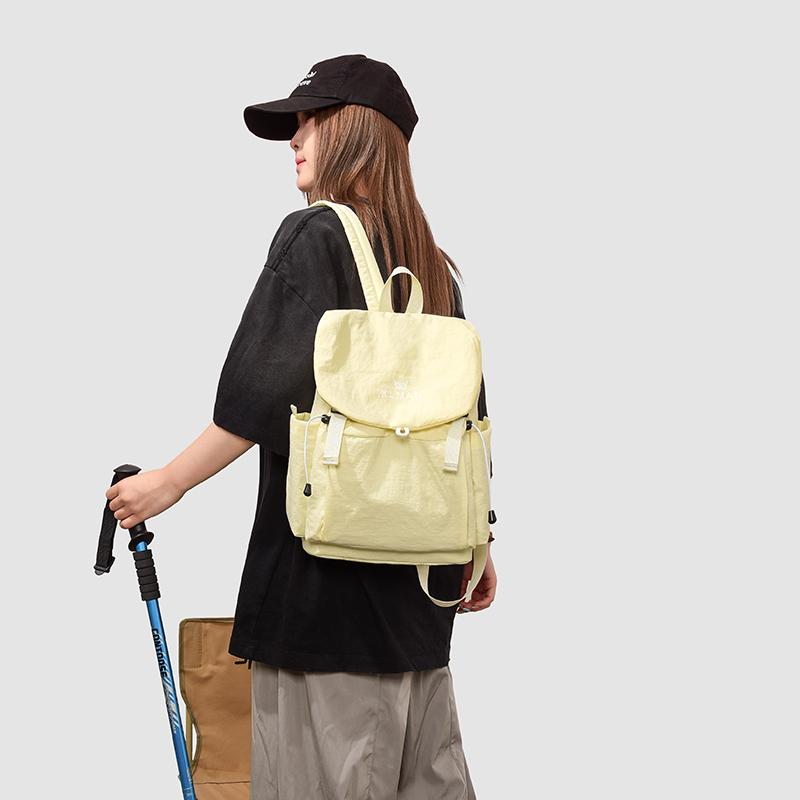 Solid Black Flap Backpack with Drawstring Closure Side Pockets Adjustable Straps Casual Travel Daypack