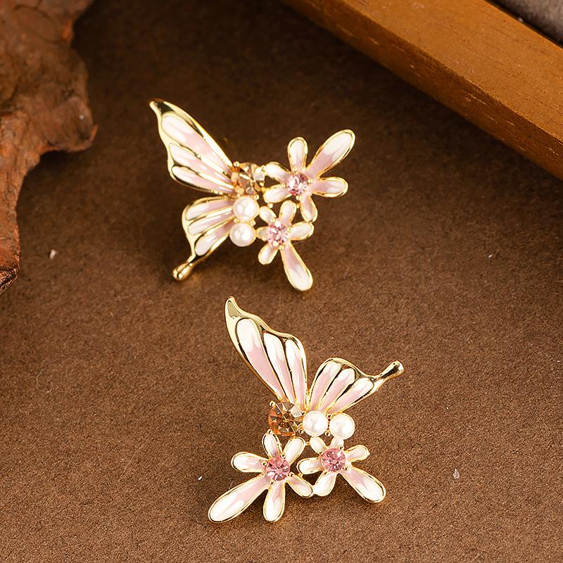 

Silver needle zircon pearl oil drop butterfly flower earrings Korean temperament light luxury stud earrings niche fashion versatile earrings