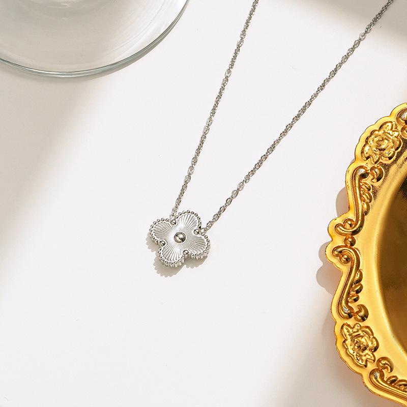 Elegant Four-Leaf Clover Necklace & Bracelet Set - Titanium Steel, Laser-Cut Design, Stylish for European & American Fashion.
