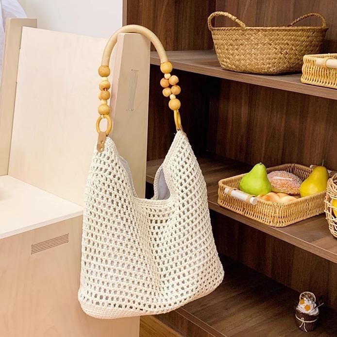 Spring new seaside beach bag women's large-capacity hollow woven shoulder bag versatile portable tote bag