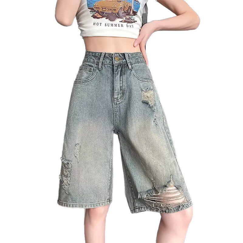Damen Nostalgische Blaue High-Waist Ripped Denim Shorts - Lockere Passform, Mittellang, Weites Bein für Birnenförmige Körper.
