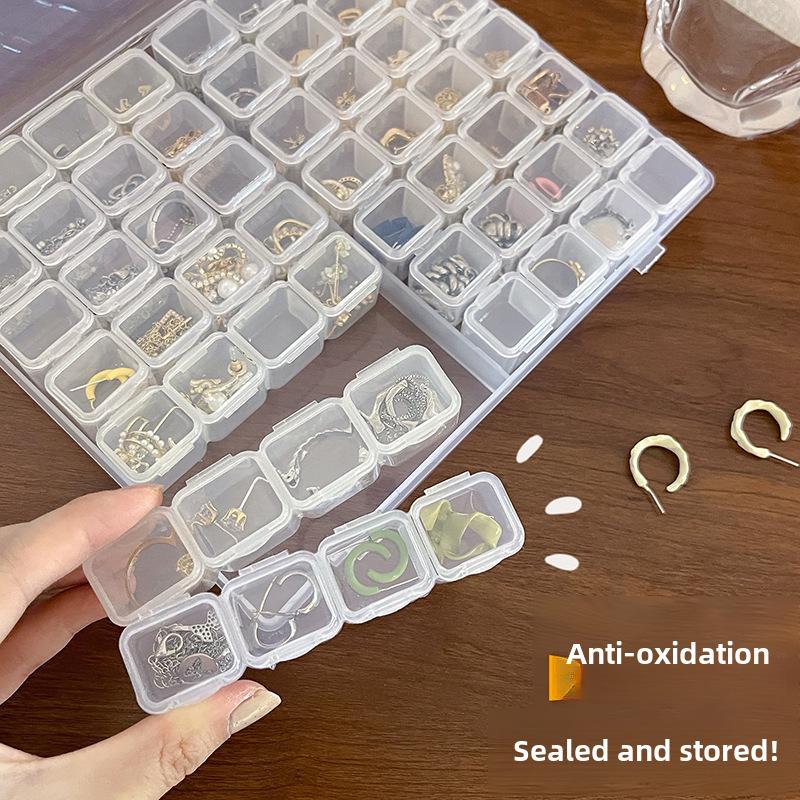 Przezroczyste przenośne pudełko na biżuterię na naszyjniki, kolczyki i pierścionki - antyoksydacyjne, wyjmowane przechowywanie, styl gwiazd