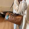 Fashionable PU Embossed Women's Handheld Travel Bag - Large Capacity Carry-on with Wet/Dry Separation for Business and Fitness.