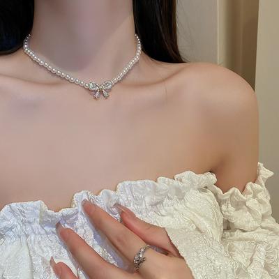 Colar de pérolas artificiais com laço de cristal para mulheres, corrente de clavícula, gargantilha, acessórios de joias