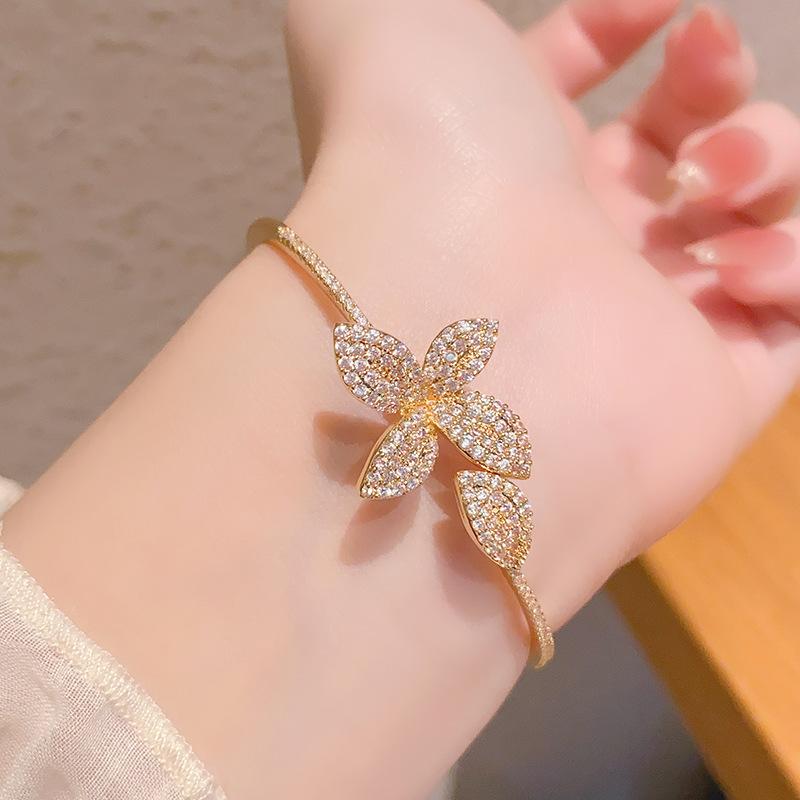 Niche four-leaf flower butterfly open zircon bracelet bracelet versatile hand jewelry women