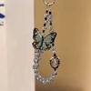 Sweet and cool wind butterfly beaded pendant ins niche design high-end mobile phone chain lanyard simple ccd key pendant