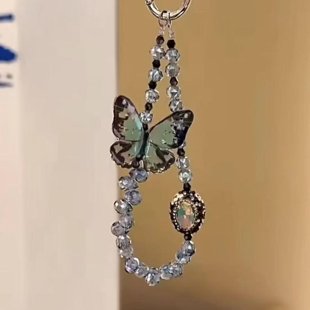 Sweet and cool wind butterfly beaded pendant ins niche design high-end mobile phone chain lanyard simple ccd key pendant