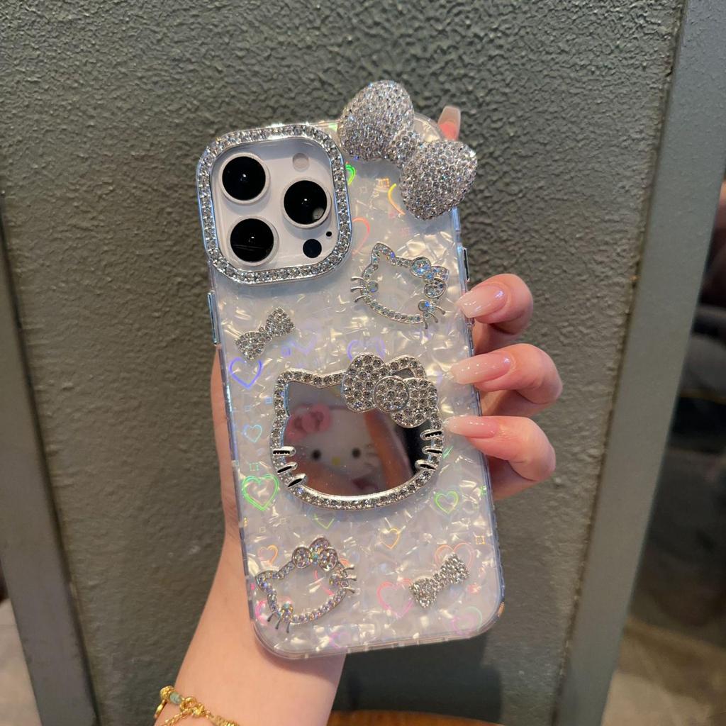 KT Cat Mirror Phone Case for Apple 16/17 Pro Max with Flashing Diamond Bow and Textured 14/15 Design.