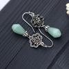 Von Xiaohongshu empfohlene Retro Magnolien Thai Silber Imitation Hetian Jade Ohrringe
